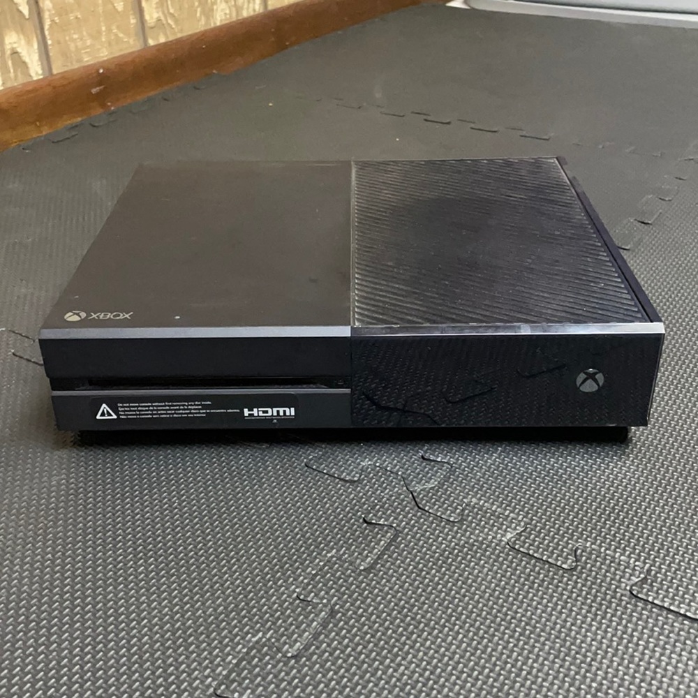 Xbox One with necessary cords. Controllers not included